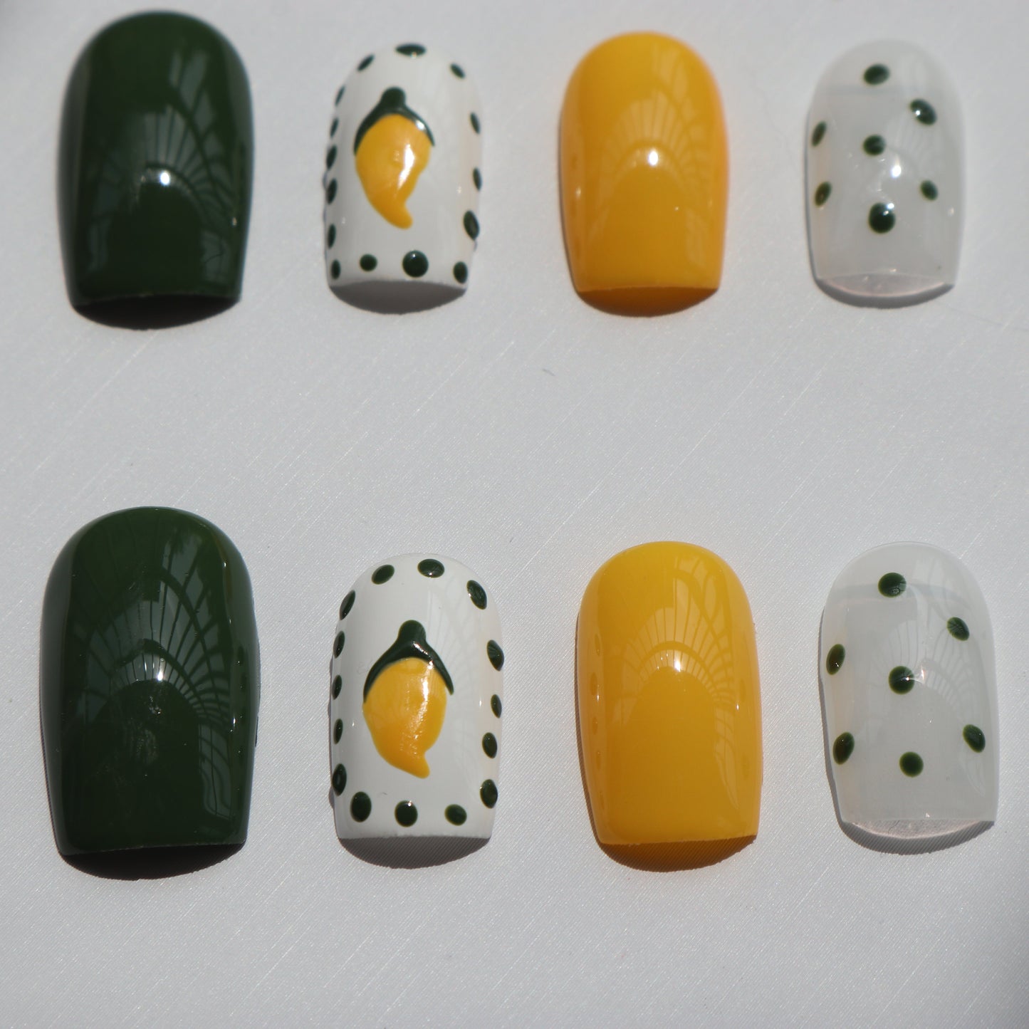 Designer: XinXin 10. Mango yellow green handmade nails