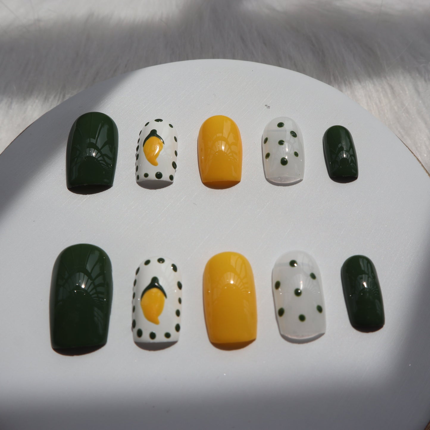 Designer: XinXin 10. Mango yellow green handmade nails