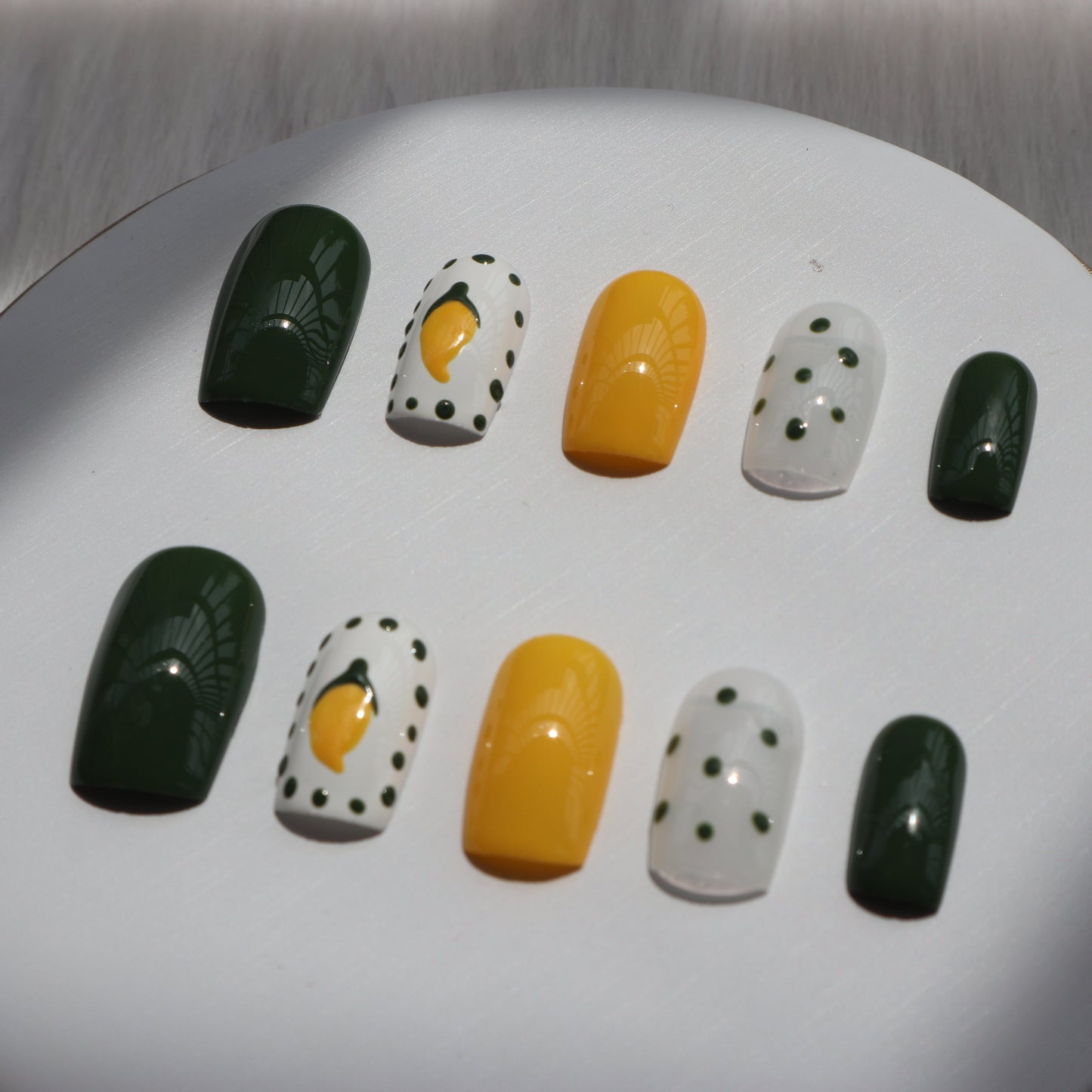 Designer: XinXin 10. Mango yellow green handmade nails