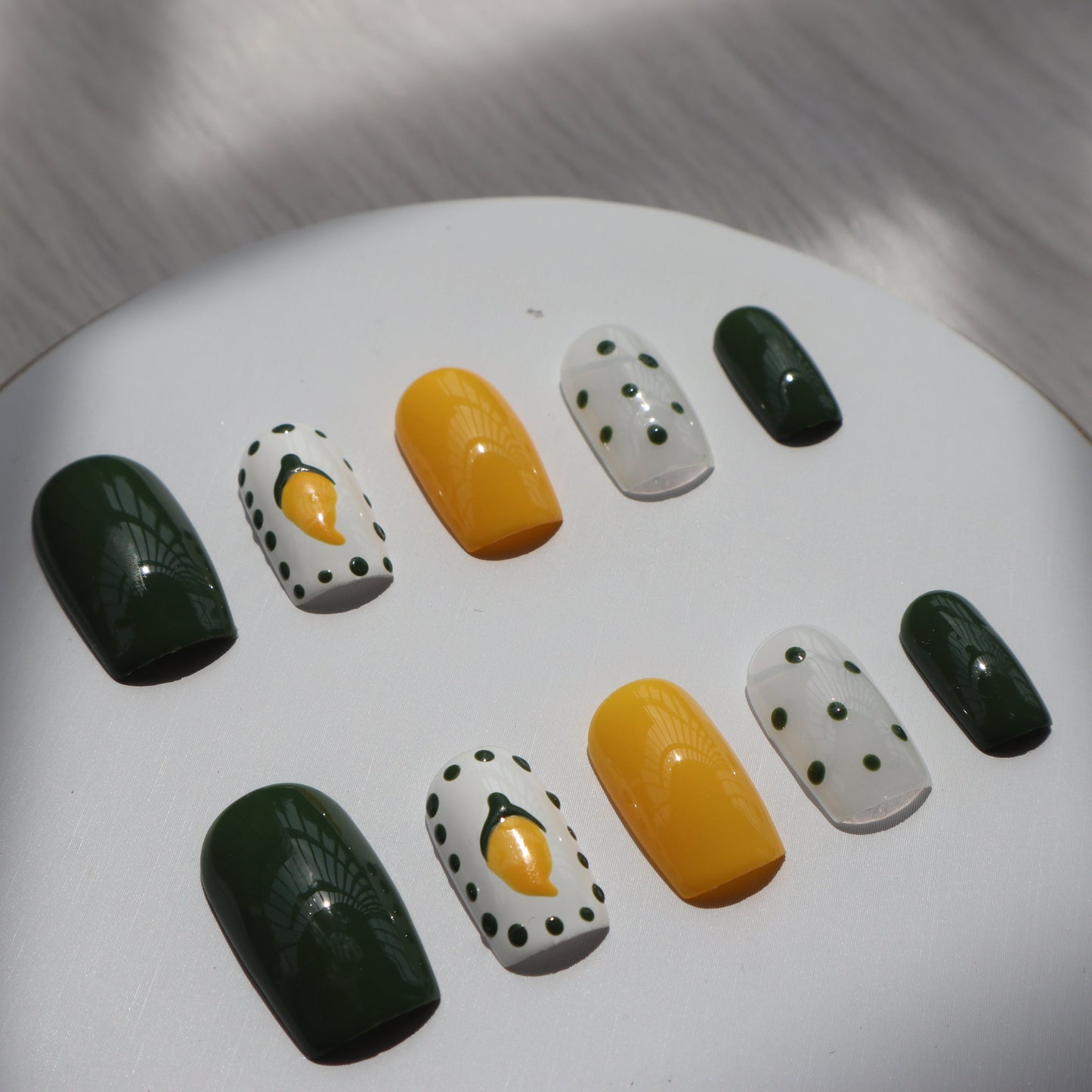 Designer: XinXin 10. Mango yellow green handmade nails