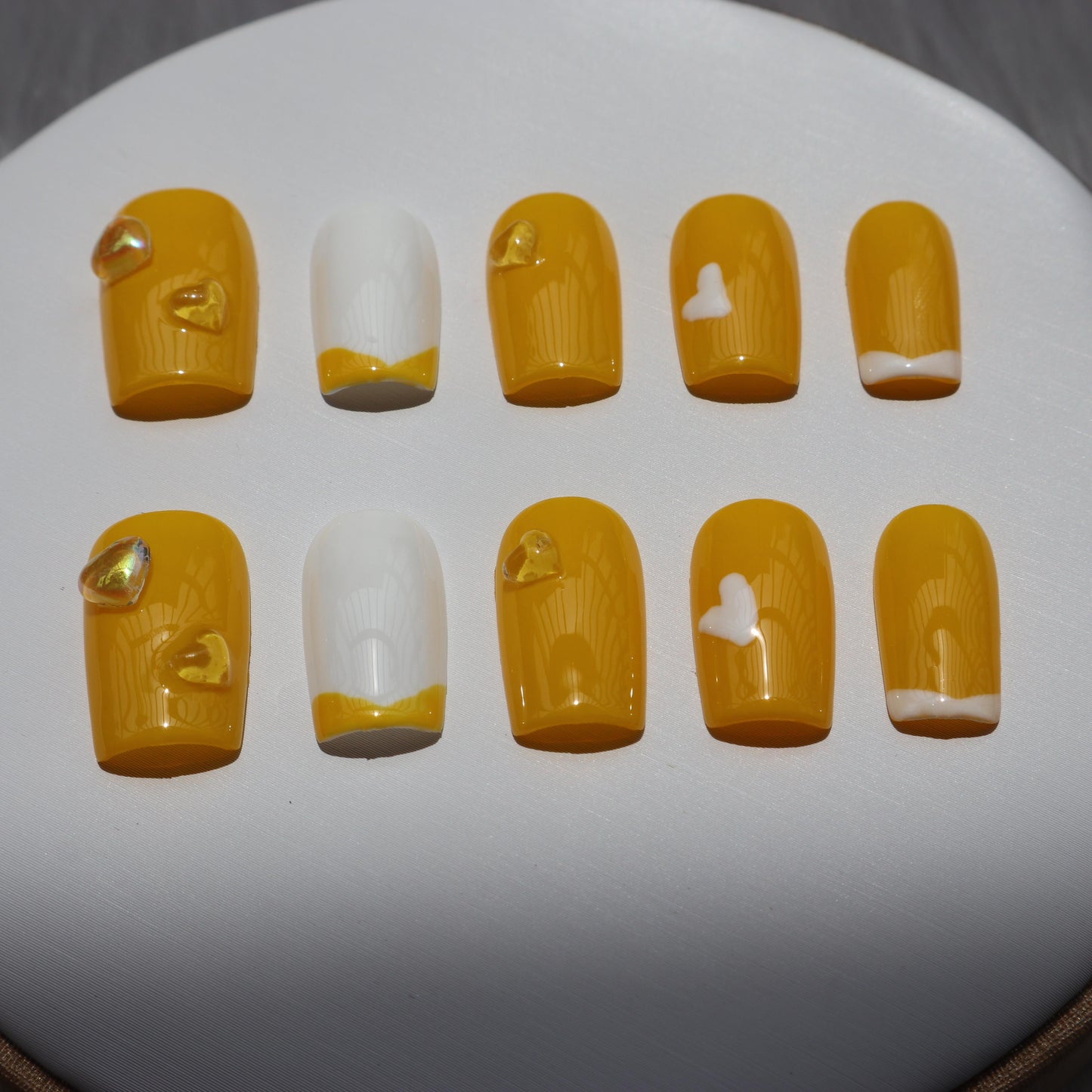 Designer: XinXin 11. Yellow white heart handmade nails