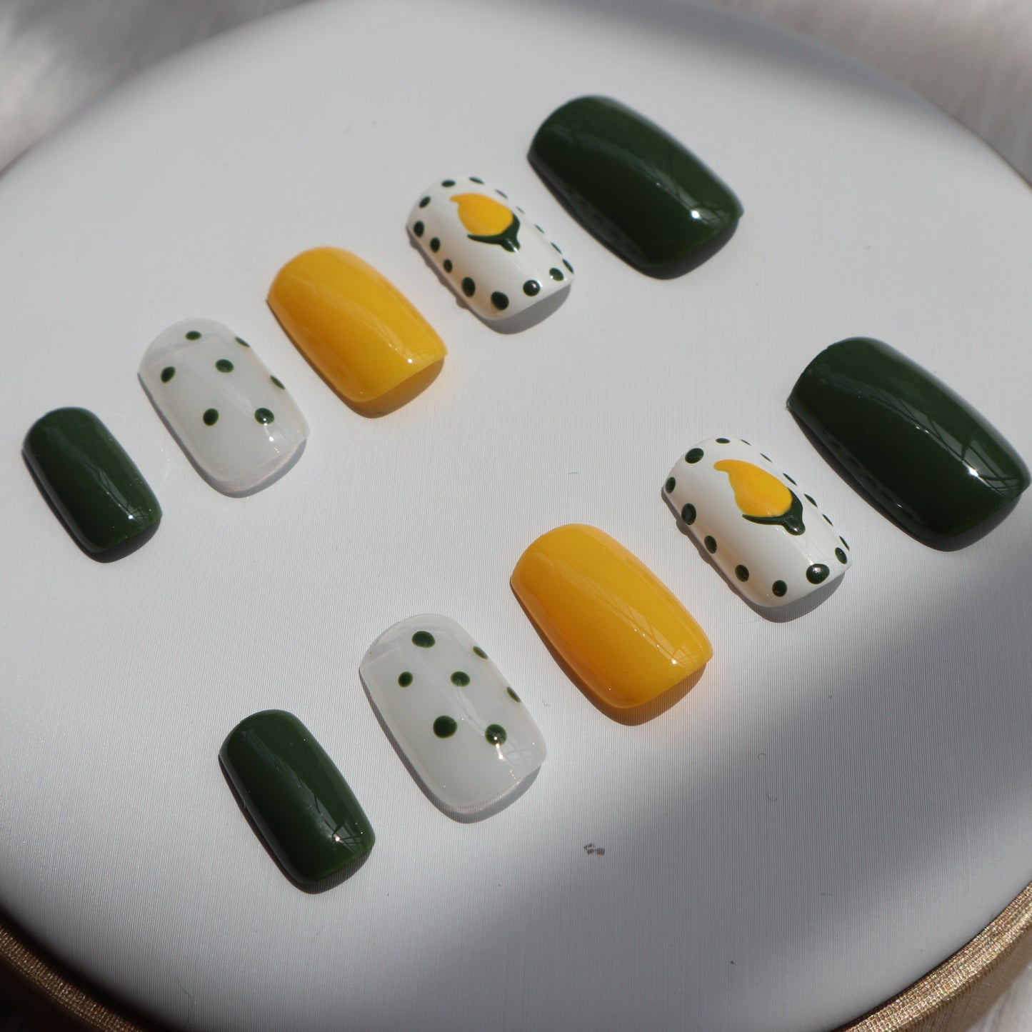 Designer: XinXin 10. Mango yellow green handmade nails