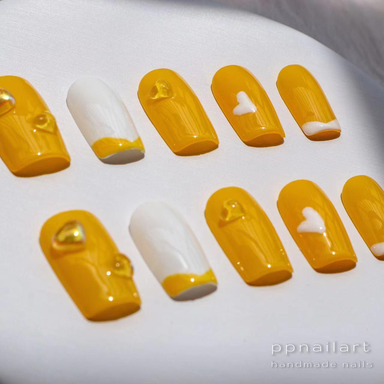 Designer: XinXin 11. Yellow white heart handmade nails